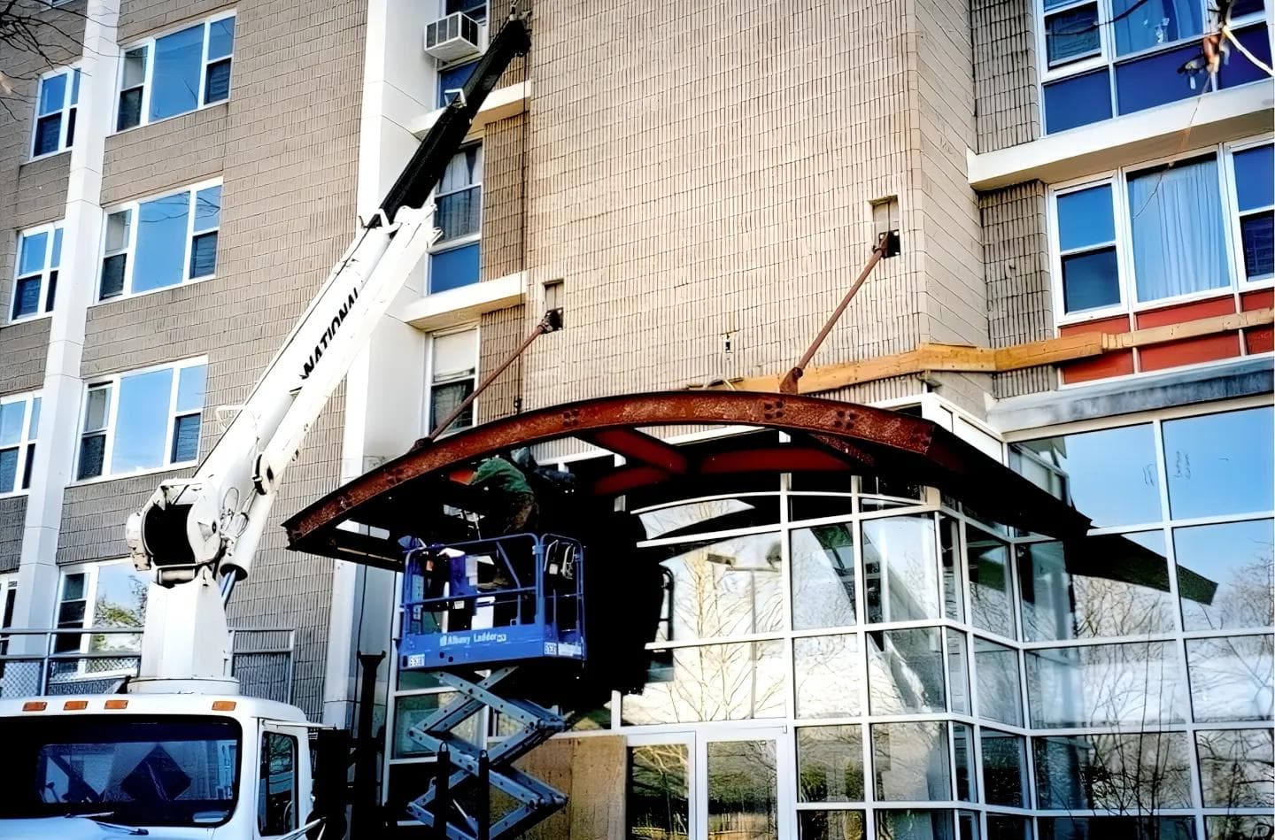 Structural steel awning being installed over apartment building entrance in Poughkeepsie, NY.