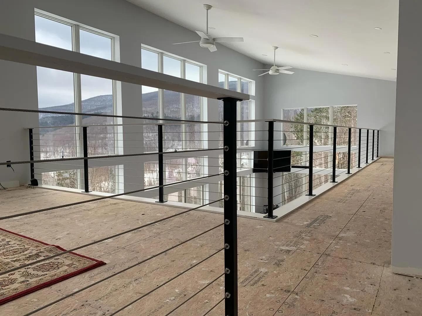 Custom steel and cable railing installation in Hunter, NY.